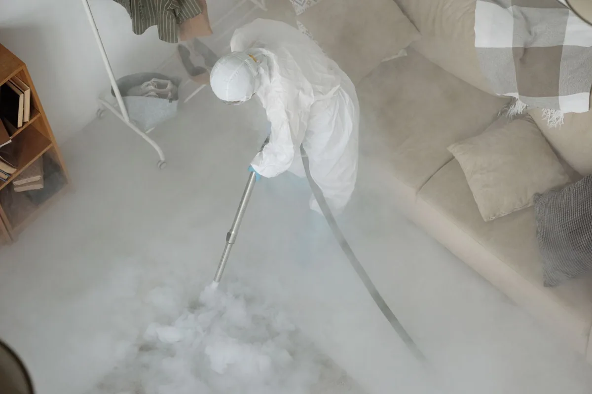 Biohazard cleanup technician in protective equipment, Burnsville, MN